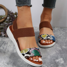 Model wearing Cerulean PU Leather Open Toe Low Heel Sandals cerulean alligator design