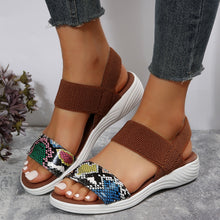 Model wearing PU Leather Open Toe Low Heel Sandals in cerulean alligator design