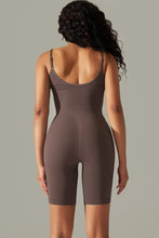 Woman modeling a back view of the Chestnut Spaghetti Strap Active Romper and contoured fit.
