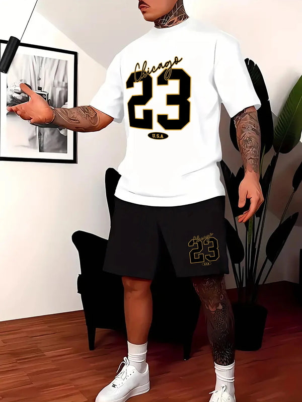 A man wearing ChiDrift 23 Legacy Set featuring a white t-shirt with 'Chicago 23' printed in black, paired with black shorts with a small U.S.A logo relaxing at home.