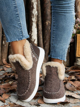 Woman wearing the chocolate Furry Suede Round Toe Flat Sneakers, front angle