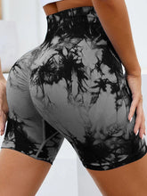 close up back view of chromaluxe high waist shorts in dark gray showing stretch fabric and flattering fit in yoga pose