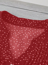 Close-up of neckline slit and buttons on deep red EverDot Flutter Top.