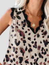 Close-up of lace trim on V-neckline of leopard fabric and Lace Detail 