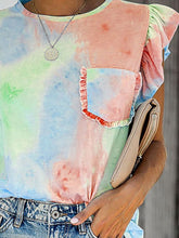 Close-up of ruffled cap sleeve and round neck design on the watermelon pink printed T-shirt.