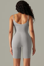 Cloudy Blue active romper back view showing thick spaghetti straps and contoured fit.