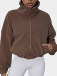 coffee brown turtleneck zip up jacket front view hand in pocket