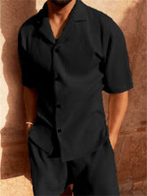 Man wearing black Cordavé CoastFlex Shorts Set with hands in pockets