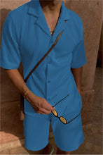 Blue Cordavé CoastFlex Shorts Set styled with manbag and sun glasses