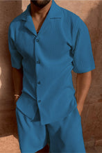 Man wearing blue Cordavé CoastFlex Shorts Set with hands in pockets