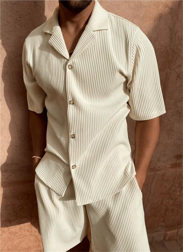 Man wearing creamy white Cordavé CoastFlex Shorts Set with hands in pockets