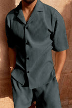 Man wearing dark grey Cordavé CoastFlex Shorts Set with hands in pockets