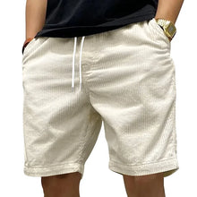Side angle view of Cordero FiveCent Flex Cord Shorts in beige.