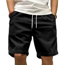 Front view of Cordero FiveCent Flex Cord Shorts in black on model.