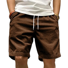 Front view of Cordero FiveCent Flex Cord Shorts in brown on model.