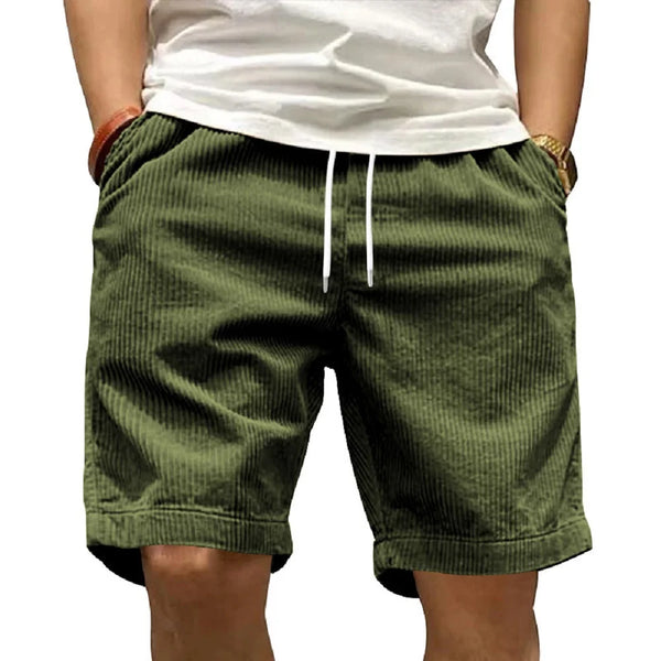 Front view of Cordero FiveCent Flex Cord Shorts in dark green on model.