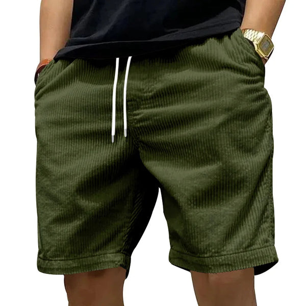 Side angle view of Cordero FiveCent Flex Cord Shorts in dark green.