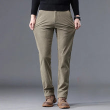 Front view of men's corduroy mid-rise thermal trousers in khaki, showcasing modern straight-leg fit and classic corduroy texture.