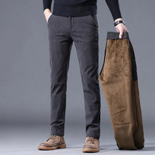 Front view of men's corduroy mid-rise thermal trousers in grey, showcasing modern straight-leg fit and classic corduroy texture