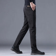 Black Corduroy Mid-Rise Trousers sideview of straight-leg cut, pocket, and relaxed fit.