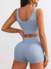 Back view of Light Blue CoreLyte PulseActive set highlighting wide straps and smooth shorts band.
