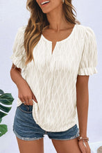 Model wearing Cream Wavelle™ Blouse paired with casual pants and accessories.