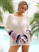 Side view of model wearing cream angel wings rainbow stripe boat neck cover-up highlighting half bell sleeve and openwork details
