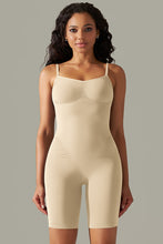 Cream spaghetti strap active romper front view with curve-hugging fit and supportive thick straps.