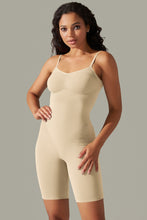 Model twirling in cream active romper showcasing flexible stretch fabric.