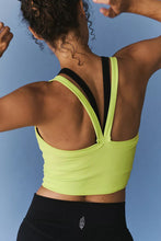 Back view showing V-straps of chartreuse Crestline Wave Active Tank.
