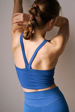 Back view showing V-shaped straps of dark blue Crestline Wave Active Tank.