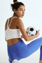 Back view showing V-shaped straps of white Crestline Wave Active Tank.
