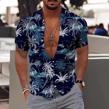 Model wearing Dark Blue Tropicscape Breeze Hawaiian Button-Up in classic palm tree print, front view