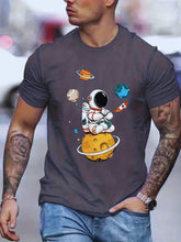 Model front view wearing men’s dark grey Cosmic Voyager astronaut graphic tee