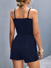 Rear view highlighting adjustable buckle straps and relaxed fit, emphasizing comfort and style, in dark blue.