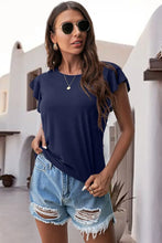 Dark Blue ruffled round neck cap sleeve blouse styled close up front view.