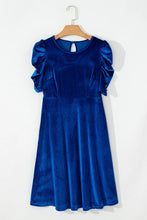Seylurette Velvet Dress in dark blue displayed on hanger showcasing round neckline and puff sleeves.