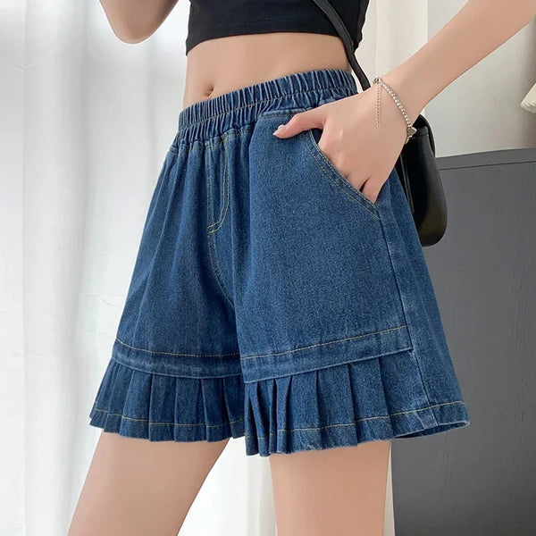 Side view of plus size dark blue shorts with highlighted front pocket detail.
