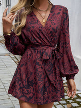 Model styled in dark brown Floravelle™ Romper with ankle boots and statement jewelry.