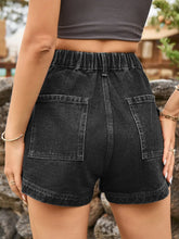 Rear image of sophisticated dark gray high-waist denim shorts with subtle pocket detailing.