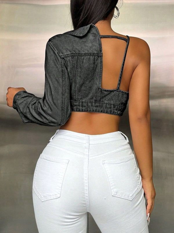 Back view of dark gray one-shoulder cropped denim top with a single long sleeve, clean seam detailing, and fitted cropped hemline
