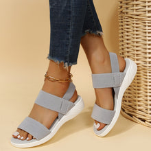 Model wearing Rubber Open Toe Low Heel Sandals, dark gray