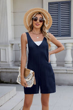 Auréla V-Strap Romper in Dark Navy paired with a sleek blazer and ankle boots