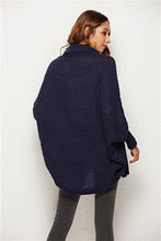 Back view of woman in Dark Navy SeraphinaWing Cardigan, showing long hemline and batwing sleeve shape.