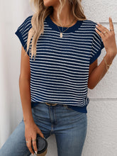 Model wearing Striped Round Neck Knit Top in dark blue, paired with denim jeans for a chic casual daytime look.