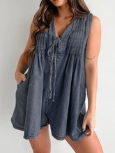 Women in navy Tied Denim Romper Playsuit with Pockets attending a party.