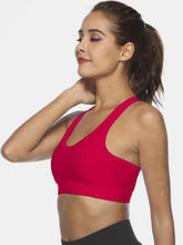 Deep red active tank mid-twirl view showing motion and fit.