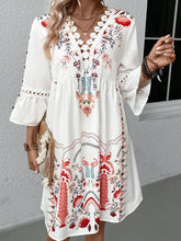 Woman at a romantic date night in Deep Red Qelorian Lace Mini Dress, accessorized with bronze jewelry and chic sandals.
