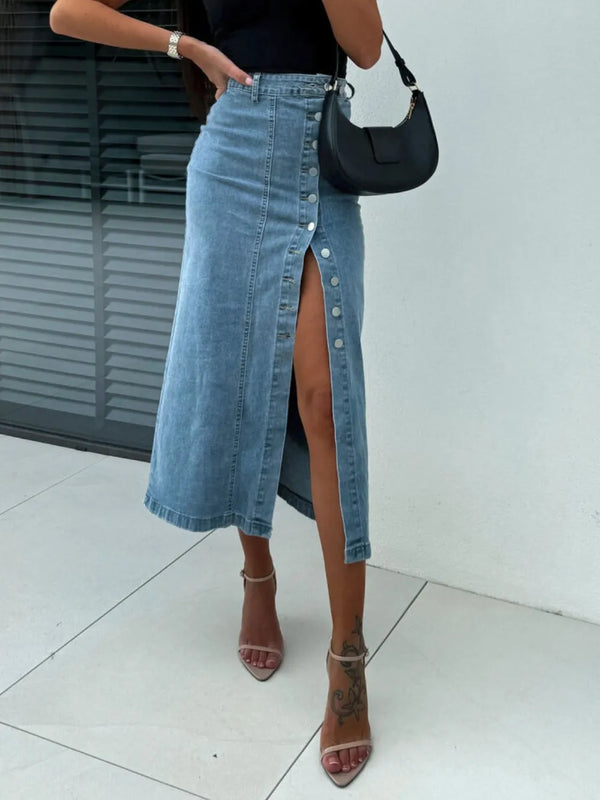 Denavelle Row Skirt front view in light blue with exposed seams and side button slit