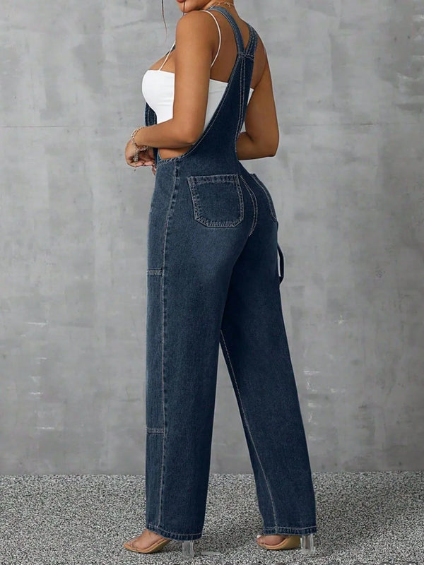 Back view of Denivelle™ Wide Strap Denim Overalls with back pockets in medium blue.